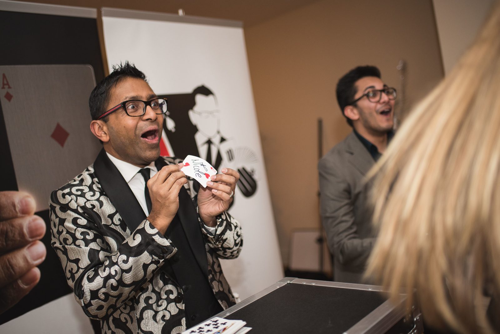 Close-up magic with guests at a corporate event