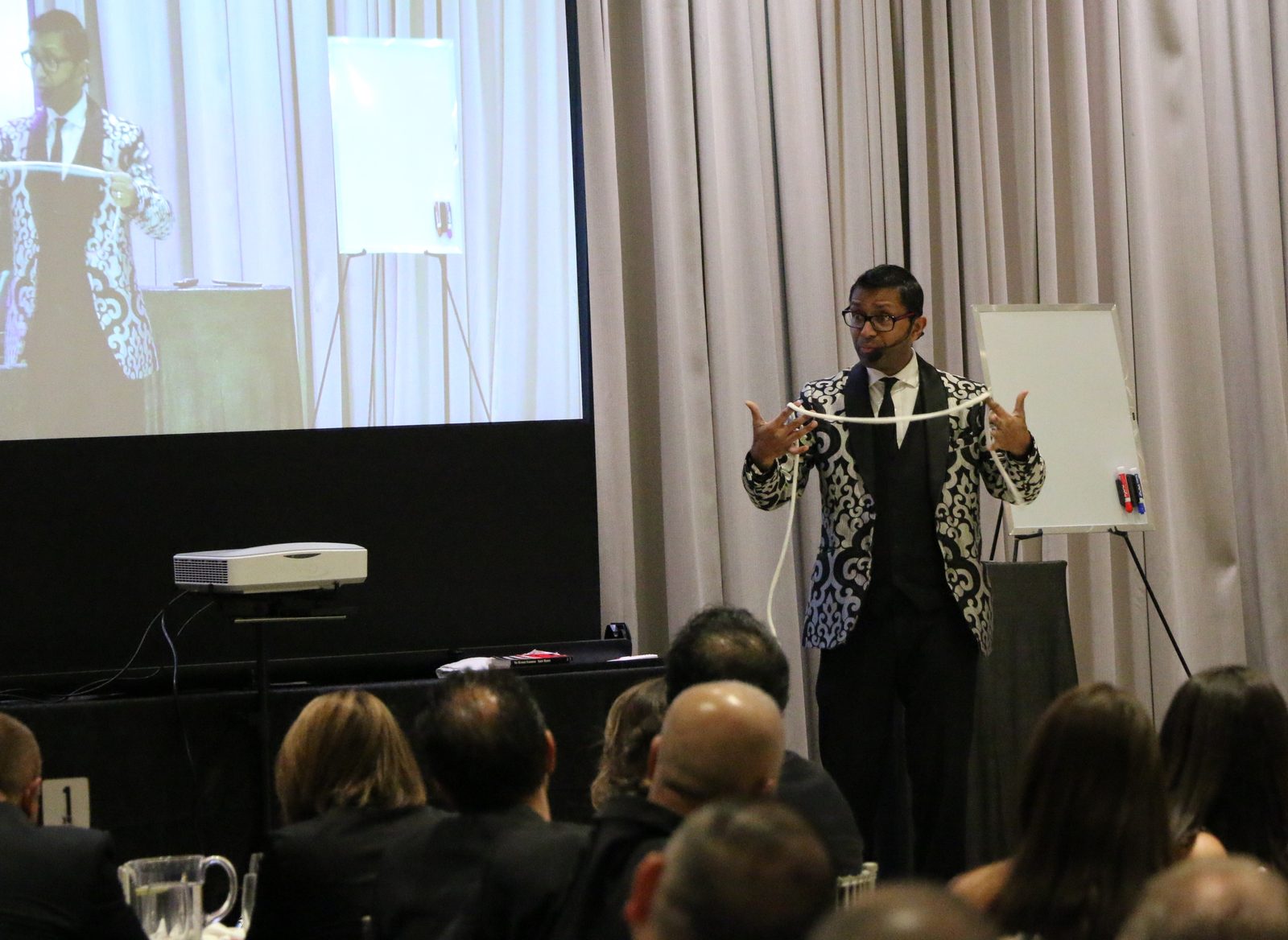 Audience volunteers on stage during a corporate magic and mind reading show