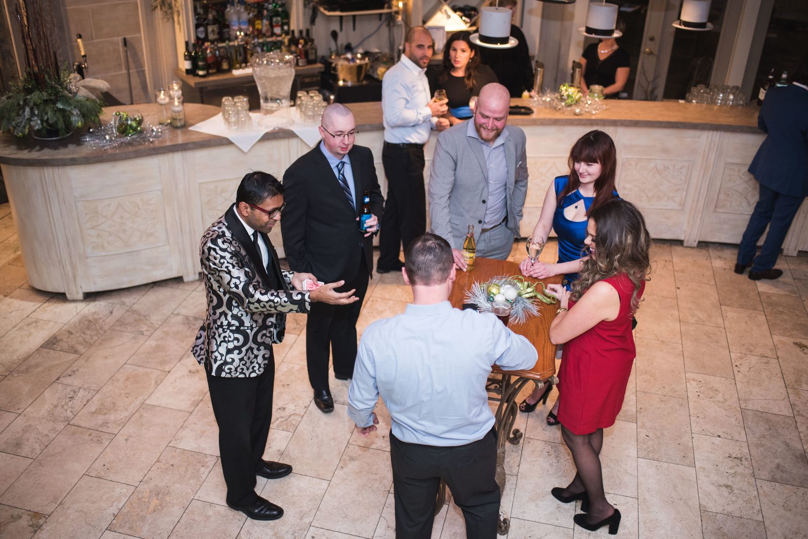 Corporate guests reacting to close-up magic by Toronto magician Wij Siva