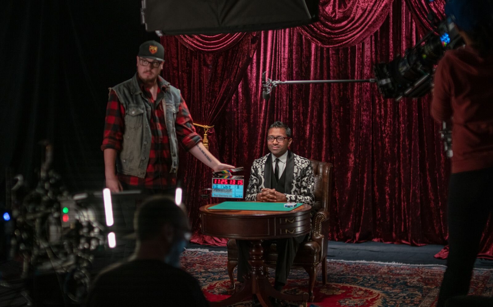 Wij Siva on a television set, filming a magic segment